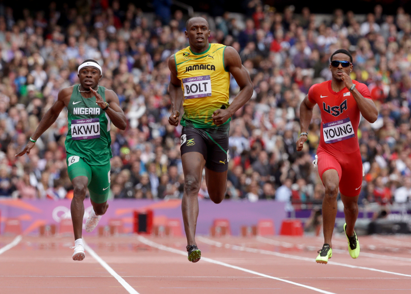 Illustration for article titled Photos Of Usain Bolt Looking Bored As He Blows Past The Best Runners In The World